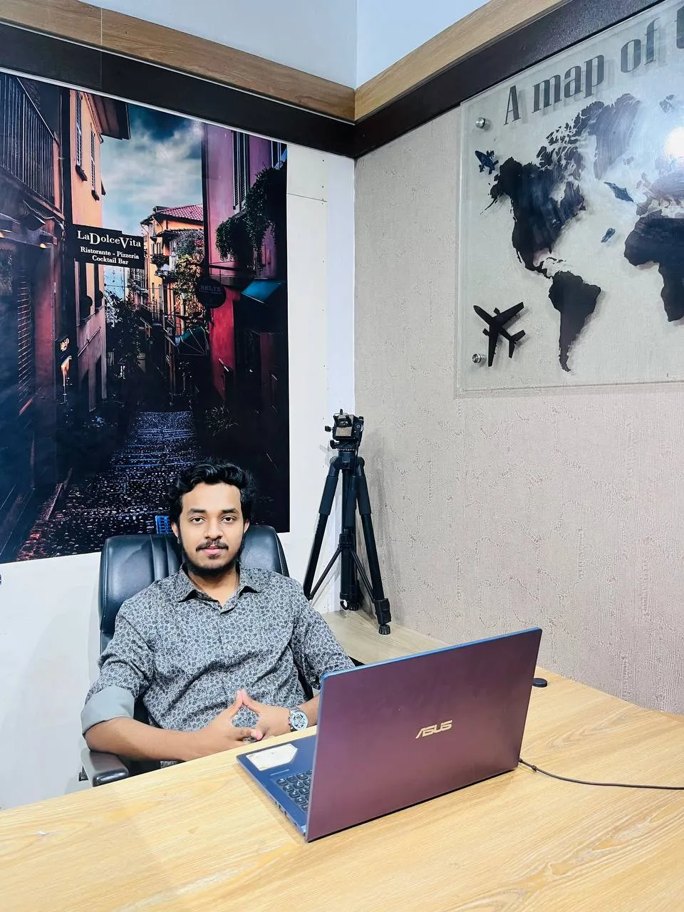 Ratul Roy at his desk with a laptop